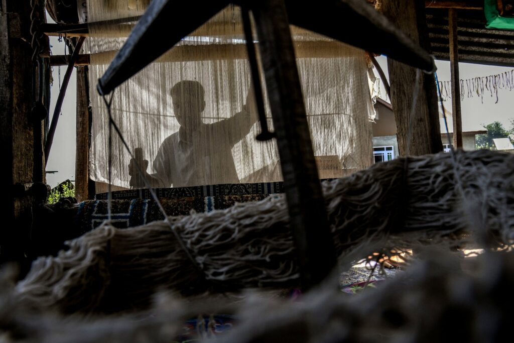 A handloom weaver at his home in central Kashmir this month. Photo by Atul Loke for NY Times