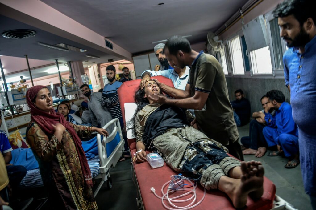 Afshana Farooq, 14, was treated in a Srinagar hospital on Aug. 9 after she was hurt in a stampede when Indian forces opened fire on demonstrators. Photo by Atul Loke for NY Times