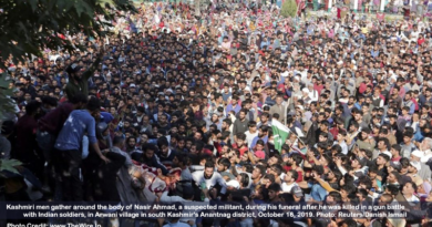 Kashmiri men gather around the body of Nasir Ahmad, a suspected militant, during his funeral after he was killed in a gun battle with Indian soldiers, in Arwani village in south Kashmir's Anantnag district, October 16, 2019. Photo: Reuters/Danish Ismail