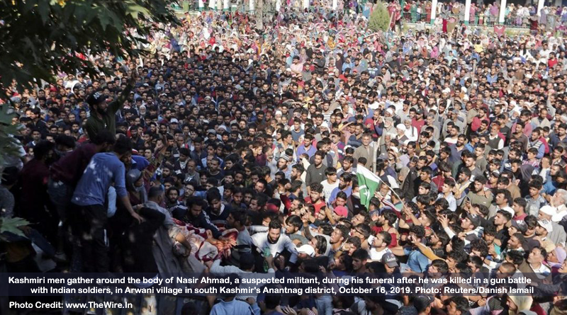 Kashmiri men gather around the body of Nasir Ahmad, a suspected militant, during his funeral after he was killed in a gun battle with Indian soldiers, in Arwani village in south Kashmir's Anantnag district, October 16, 2019. Photo: Reuters/Danish Ismail