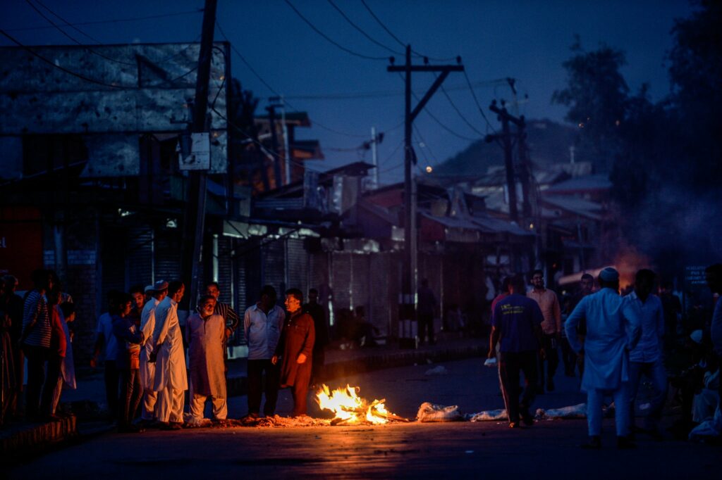 Protesters blocking a street in Srinagar last month. Photo by Atul Loke for NY Times