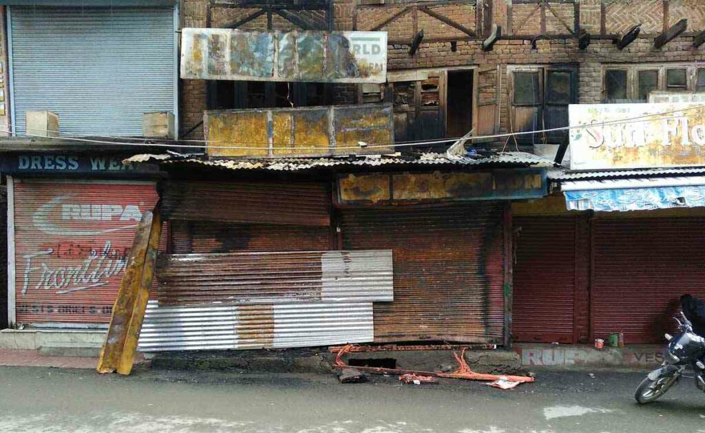 The charred remains of four shops that were burned down mysteriously in Srinagar's downtown area on November 20