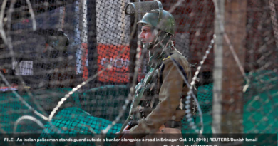 An Indian policeman stands guard outside a bunker alongside a road in Srinagar October 31, 2019. REUTERS