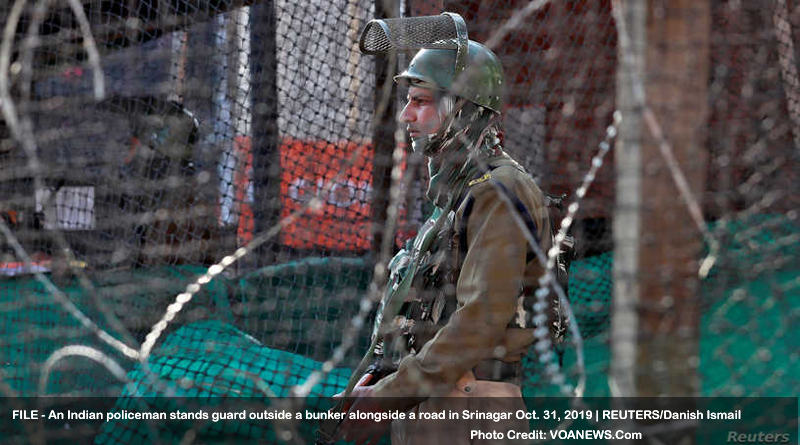 An Indian policeman stands guard outside a bunker alongside a road in Srinagar October 31, 2019. REUTERS