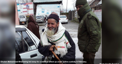 Ghulam Mohammad Bhat being led away for a medical check up under police custody in February.