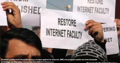 Kashmiri youths hold placards during a protest against an Internet, SMS and prepaid mobile services blockade in Srinagar on Thursday.