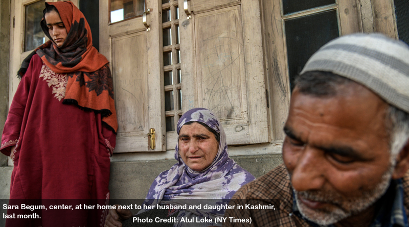 Sara Begum, center, at her home next to her husband and daughter in Kashmir, last month.